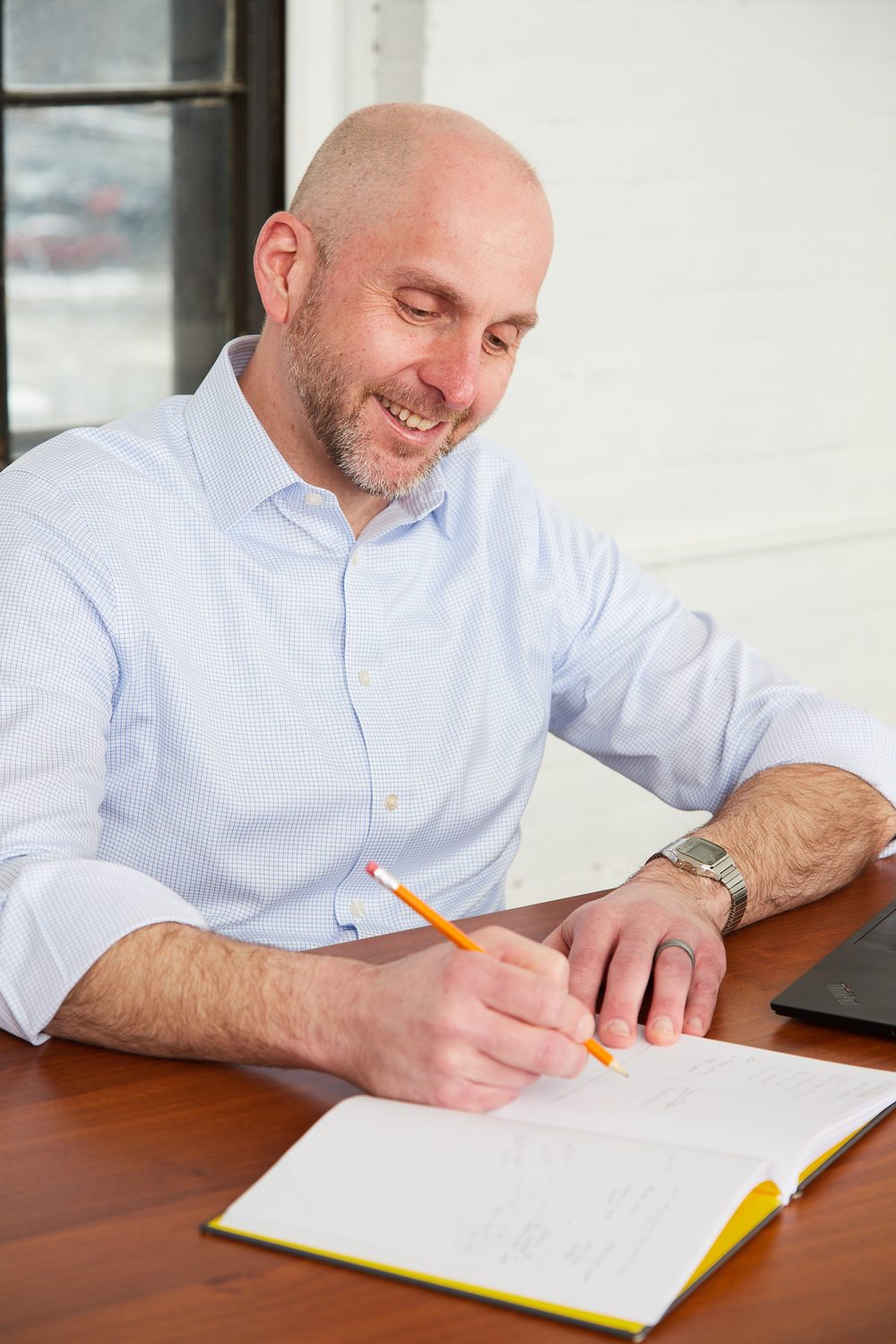 Scott Humphries writing in a notebook