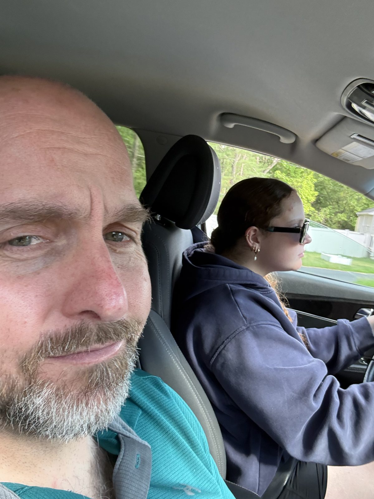 Scott Humphries riding along as his younger daughter practices driving